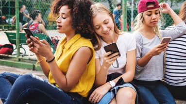 young people using smartphones beauty products